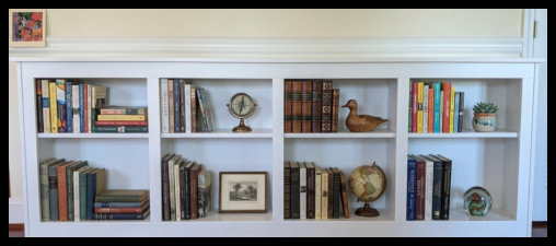 Custom 8-foot wide white freestanding bookcase featuring a solid Maple veneer core tabletop and integrated vertical divider supports.