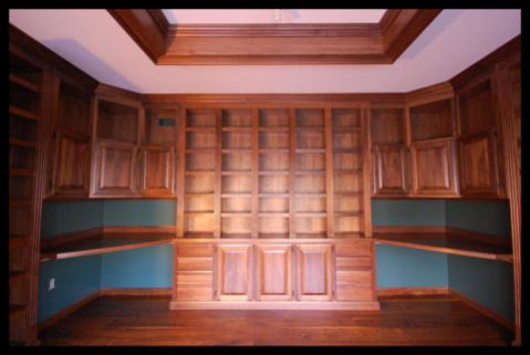 Solid Walnut Library Base Cabinetry with Raised Panel Doors, Drawer Banks, and Fluted Molding - No Particle Board.
