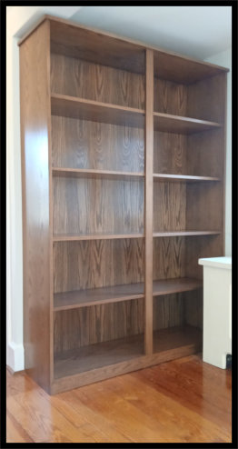 Custom red oak bookcase with deep shelving for vinyl records and books with tabletop.