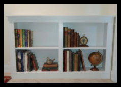 Custom double-wide white portable bookcase handcrafted with a Maple veneer core and a solid tabletop, designed for versatile home placement.